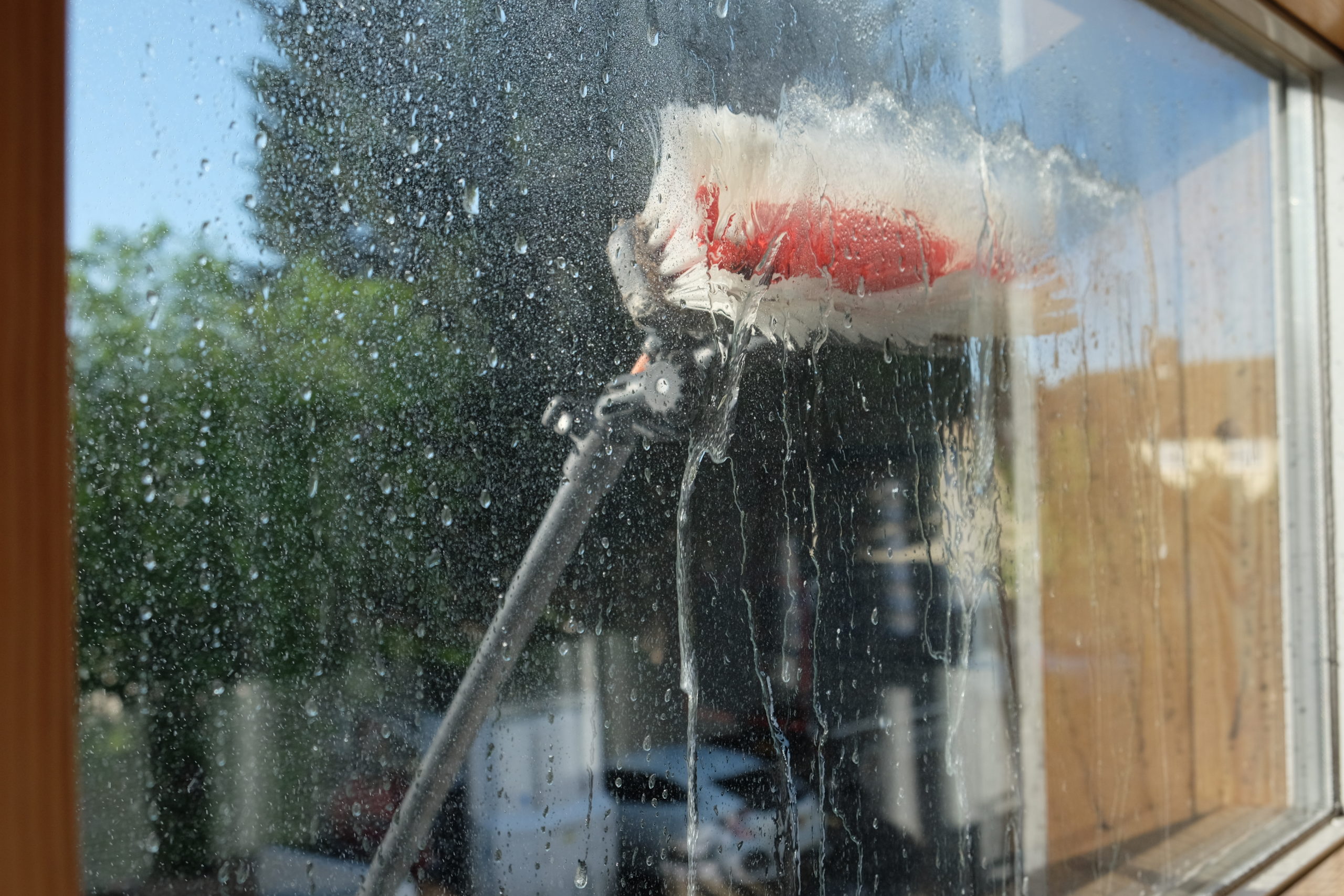 Reach and wash system on window